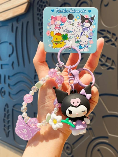 Sanrio Kuromi Serene Floral Series Charm – Kuromi with Black Headband, Pink Skull Decor & Purple Dress, Holding White Daisy, Accented with Transparent Beads & Pearl Charms, Crafted with Soft Durable Vinyl & Sharp Printing, Perfect for Keyeals/Hand Ropes/Bags, Fan Florm.