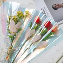 100个情人节花束包装袋，鲜花包装袋，英文字母心形图案包装袋，加厚防水包装袋，节日礼品包装袋，适用于情人节花束包装、鲜花礼品包装、各种鲜花包装、婚礼、生日、派对包装。 - 彩色 - 查看 4
