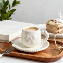 A Set Of Ceramic Coffee Cups And Saucers With Bow-Tie Relief Design (100-180ml Capacity). Perfect For Home Kitchens, Dining Rooms, Or Living Spaces. Each Cup Comes With A Matching Saucer. Ideal For Serving Tea, Coffee, Milk, Water, Or Juice. Suitable For Outdoor Use, Weddings, Parties, Gifting, Or Birthdays.