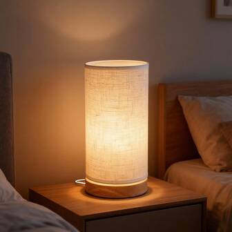 Lámpara de mesa de tela moderna con conexión USB, luz cálida, base de madera, resistente y duradera, ideal para uso doméstico en dormitorios, estudios, salas de estar y tiendas.