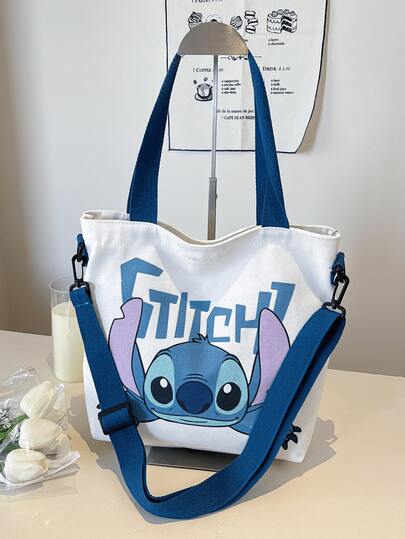 史迪奇帆布手提袋，厚帆布材质，可爱史迪奇躺卧图案+蓝色“史迪奇”字样，容量大、轻便舒适，可装书籍/笔记本电脑，适合青少年/女孩/女性/动漫爱好者，可用于学校/工作/购物/旅行/休闲外出，必备单品，美观的生日/节日/特殊场合礼物。