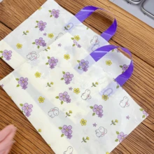 100 piezas Bolsas de tote de regalo premium, bolsas de embalaje para prendas de mujer, bolsas de tote reutilizables con estampado de flores y conejos para fiestas y días festivos, almacenamiento doméstico y compras en supermercados/tiendas de conveniencia, bolsa de almacenamiento de viaje y al aire libre para ropa, zapatos y otros artículos - Multicolor - Ver 3