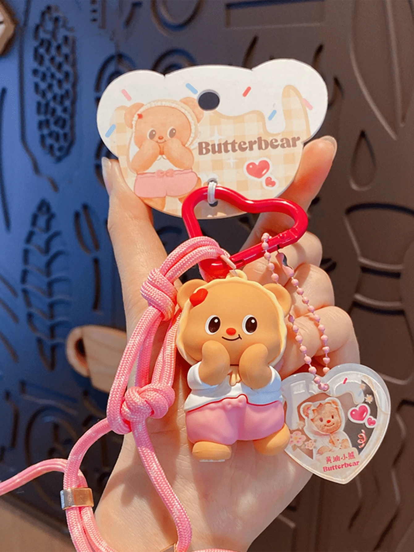 Official Butterbear Pink Daily Style Keychain Adorable Plush-Look PVC Pendant with Braided Lanyard Heart-Shaped Carabiner Fashion Bag Charm for Teens Daily Commute Gift