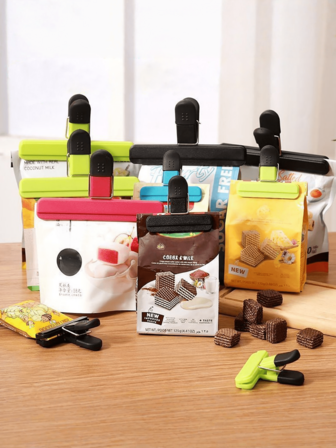 4个/套 随机颜色 T 型食品密封夹，强力密封夹，适用于薯片袋、零食、厨房食谱、办公文件、乐谱等，具有防漏防潮功能；T 型塑料袋密封夹，防潮保鲜，适合食品储存