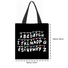 Merchandise, Letter Light Tote Bag - Iconic Letter Wreath - Letter Light Design Tote Bag - Letter Light