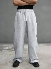 Men's Loose Casual Sports Pants, Featuring Minimalist Solid Color Wide Leg Design, Drawstring Waist, Large Pockets, Suitable For Daily Walking, Work, Travel And Other Occasions. Made Of 100% Polyester Fabric, This Is A Lightweight Wide-Leg Casual Pant Suitable For All Seasons. If You Need A Thicker Version, Please Visit Our Store. - Light Grey - View 9