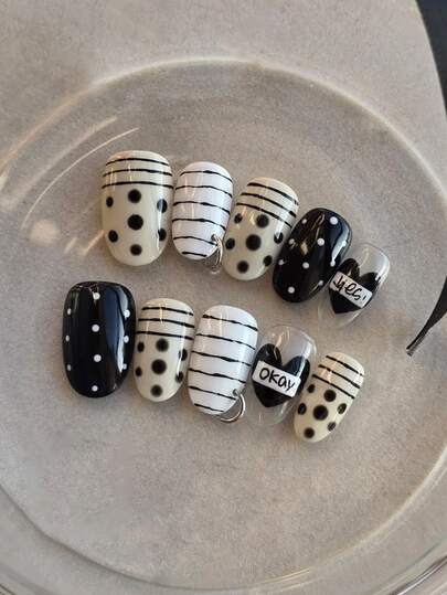 Y2K Black And White 10 Piece Oval Shaped Press On Nail Set, Decorated With Black And White Stripes, Polka Dots, Hearts, And Metal Rings, Featuring A Sweet And Cool Style For Spicy Girls To Wear. It Is A Fully Detachable Fake Nail Set, Suitable For Office Workers, Students, Party Girls, And Nail Supplies Of All Seasons. It Comes With 1 Jelly Gel And 1 Nail File.