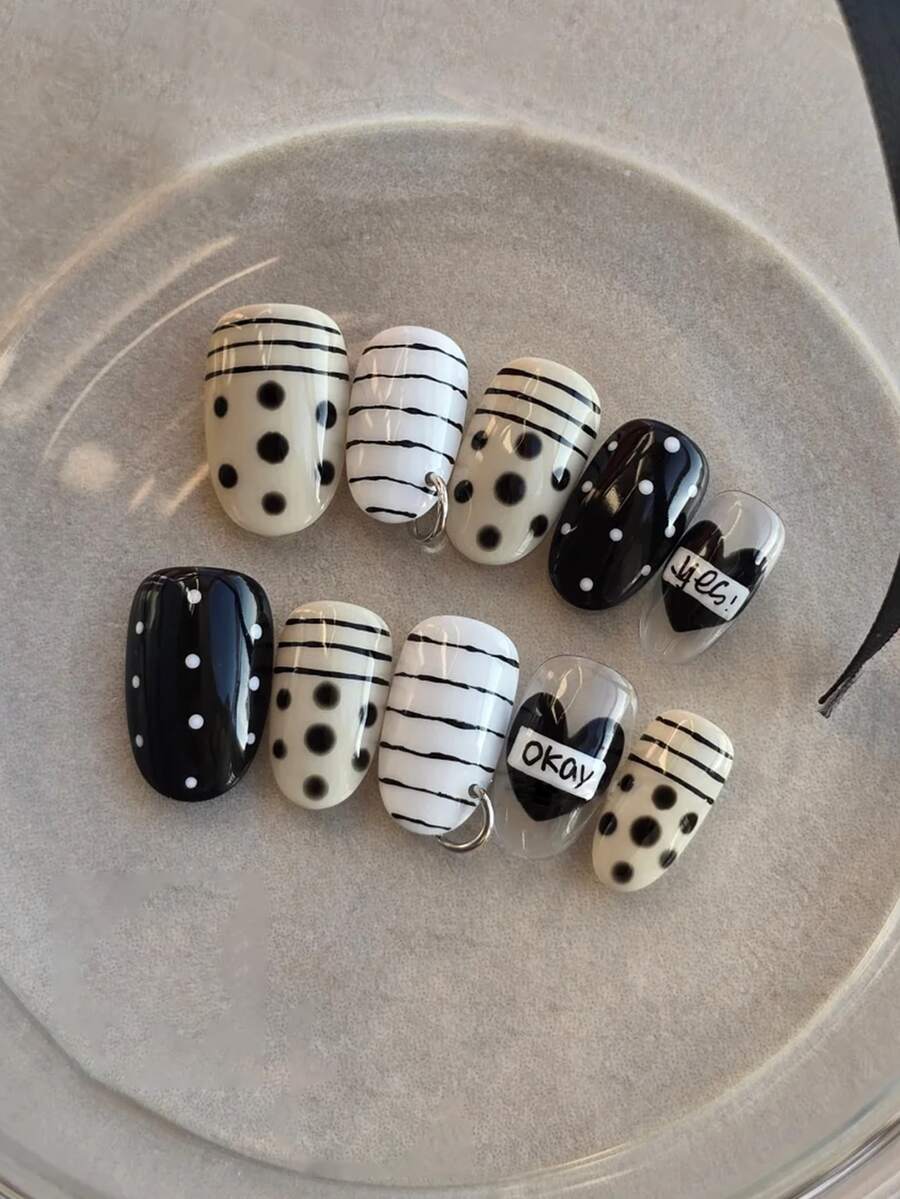 Y2K Black And White 10 Piece Oval Shaped Press On Nail Set, Decorated With Black And White Stripes, Polka Dots, Hearts, And Metal Rings, Featuring A Sweet And Cool Style For Spicy Girls To Wear. It Is A Fully Detachable Fake Nail Set, Suitable For Office Workers, Students, Party Girls, And Nail Supplies Of All Seasons. It Comes With 1 Jelly Gel And 1 Nail File. - Black and White - View 1