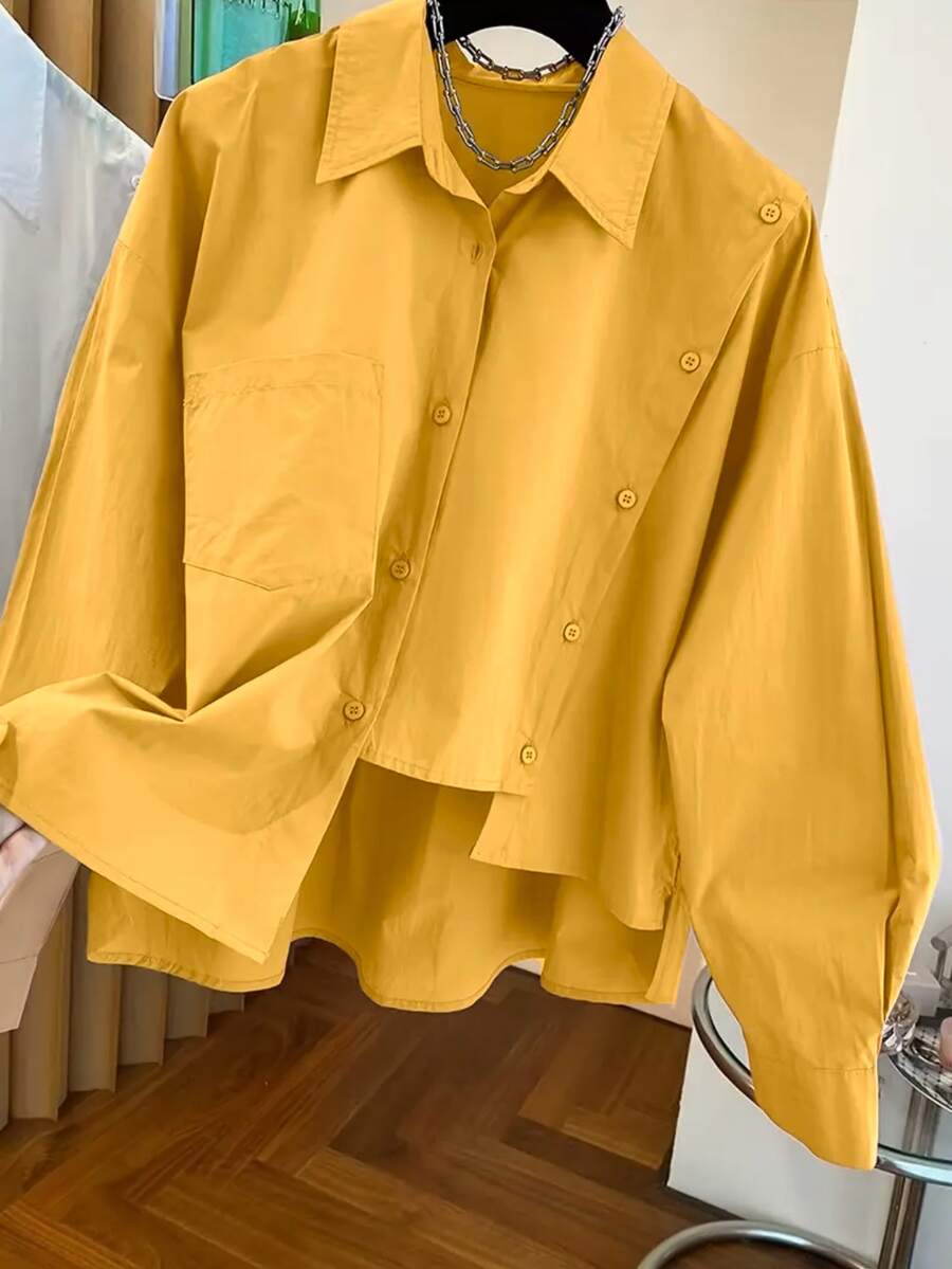女士不对称下摆衬衫，粉色、黑色、白色、黄色等多种颜色可选，适合春、夏、秋、冬四季穿着。纯色前襟纽扣口袋设计，优雅休闲，适合办公室穿着，也适合狂欢节、情人节、郊游、毕业季、复活节等场合。 - 黃色 - 查看 1