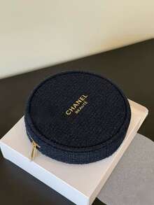 CHANEL Limited Edition Navy Blue Embossed Wool Round Cosmetic Bag, With Gold Logo And Camellia Zipper Pull, Luxury Makeup Pouch - Navy Blue - View 1