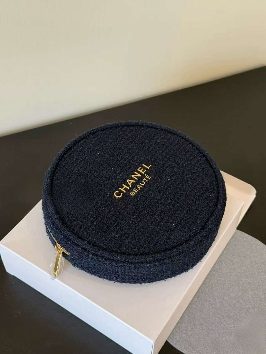 CHANEL Limited Edition Navy Blue Embossed Wool Round Cosmetic Bag, With Gold Logo And Camellia Zipper Pull, Luxury Makeup Pouch - Navy Blue - View 1