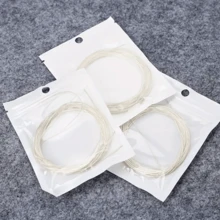 6根/套白色尼龙古典吉他弦，提升原声吉他音色！尼龙弦，适用于原声吉他，独立包装，吉他配件，民谣吉他套装配件，全套民谣吉他配件，音色明亮活泼，提升演奏表现，适合初学者和专业乐手，乐器配件，送给音乐爱好者的完美吉他礼物，生日、情人节、新年皆宜。 - 彩色 - 查看 12