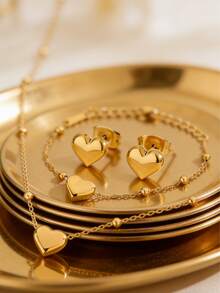 Bộ trang sức thép không gỉ lãng mạn gồm dây chuyền hạt thép bất đối xứng và mặt dây chuyền hình trái tim, kèm vòng tay và bông tai cùng kiểu, thích hợp cho phụ nữ đeo khi hẹn hò, đi mua sắm hoặc làm quà tặng Ngày Valentine cho người yêu. - Vàng - Xem 5