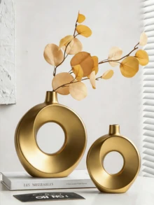 1 Bình hoa nhựa hình tròn màu đen - Thiết kế tối giản hiện đại, lý tưởng cho kệ phòng khách, bàn cà phê và mặt bàn trang điểm. Có thể cắm hoa nhỏ/lá giả, tạo vẻ thanh lịch, một chiếc bình trang trí sang trọng phổ biến cho không gian nội thất đầy phong cách. - Nhiều màu - Xem 4