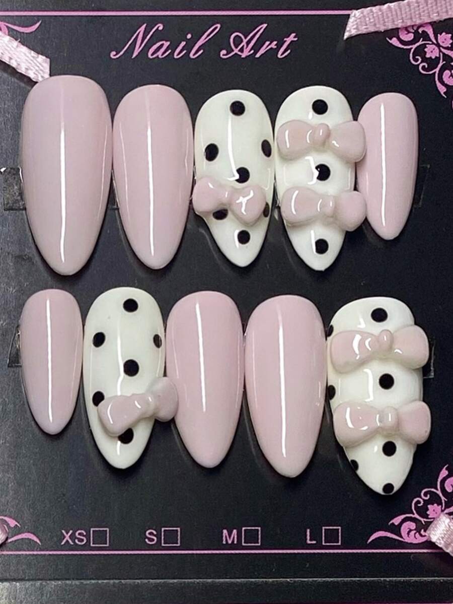 Valentine's Day Pink And White 10 Piece Medium To Long Almond Shaped Press On Nail Set, Featuring Gentle Black And White Polka Dots And Sweet Pink Bow Decorations For A Cute And Sweet Wearing Style. It Is A Fully Detachable Fake Nail Set, Suitable For Office Workers, Students, Party Girls, And Beauty Products Of All Seasons. It Comes With 1 Jelly Gel And 1 Nail File. - Baby Pink - View 1