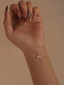 1条925纯银可爱蝴蝶结立方氧化锆链条手链，精致珠宝礼品，适合女性日常佩戴、派对和婚礼场合。 - 金色 - 查看 3