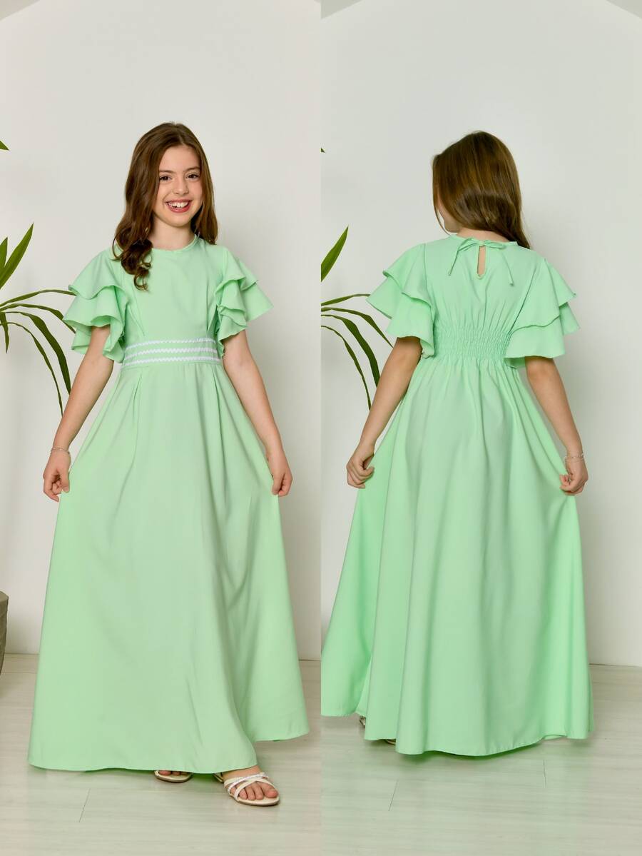 Evangelical Long Dress For Girls And Teenagers With Trio Detail At The Waist And Layered Sleeves | Long, Flared Dress With Elastic At The Back | Sizes 10 To 16 | Colors: Baby Blue, Green, Pink, Lavender, And Navy Blue | Elegant And Comfortable Outfit For Birthdays, Parties, Christmas, Graduations, And Special Events | Classic Teen Dress With A Loose Fit | Delicate Model With Wide Sleeves And Refined Finish | Long Dress For Pre-Teen And Teenage Girls | Children's Clothing For Special Occasions And Dressy Casual Wear | Ideal Gift For Girls | Flared Dress With Lightweight Fabric And Soft Touch | Charming, Discreet, And Comfortable Look For Various Occasions - Màu xanh Bạc hà - Xem 1