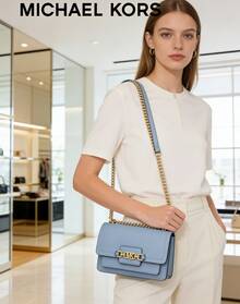 Michael Kors HEATHER Small Crossbody Bag, Light Blue 32S2G7HC0L457. Crafted With Premium Leather, Featuring A Flap Design And Upgraded Golden Hardware With Brand Logo. Spacious Interior Can Accommodate Lipstick And Essential Items. Fashionable Chain Strap, Making It An Ideal Choice To Pair With Formal Attire. - Light Blue - View 2