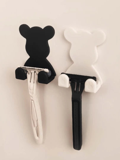 2 件装免钻孔剃须刀收纳架，兼具衣物包袋挂钩、壁挂式电源插头挂钩、衣物包袋收纳挂钩、多功能壁挂式剃须刀架：多功能解决方案！塑料壁挂式剃须刀架，多功能免钻孔电源插头剃须刀架，兼具手机/包袋收纳功能。经典黑和纯白两色可选，这款剃须刀架不仅仅用于存放剃须刀。