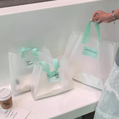 50pcs Party Gift Clothing Packaging Bags, High-End Women's Shopping Bags, Transparent Frosted Handheld Storage Bags, Wedding Packaging Bags, Gift Packaging Bags, Reusable Packaging Bags, Thick Waterproof Portable Large Capacity Tote Bags, Outdoor Travel Daily Necessities Collection Bags. Suitable For Holidays, New Year's, Weddings, Parties, Shopping Bags, Birthday Gift Bags, Party Gift Bags