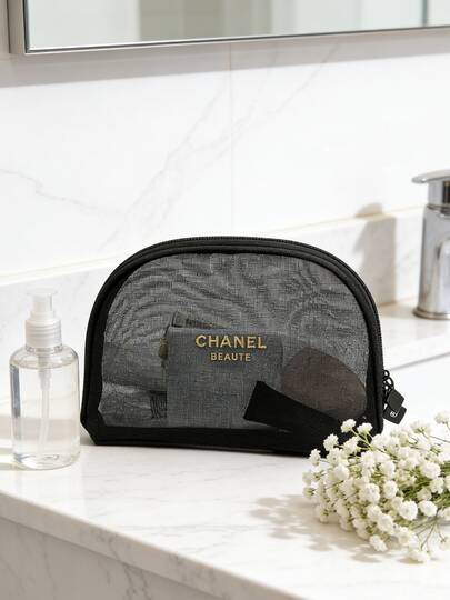 CHANEL Przezroczysta kosmetyczka, czarna siateczka, wykończenie z wytrzymałego materiału, przezroczysta saszetka, modna torba