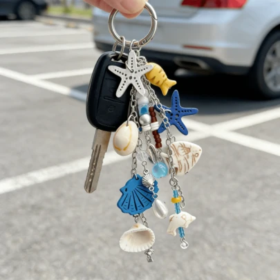 Llavero con forma de estrella de mar de moda: decoración de bolso y coche con tema oceánico, regalo de estilo náutico y accesorio práctico para llaves, regalo para la temporada de regreso a clases