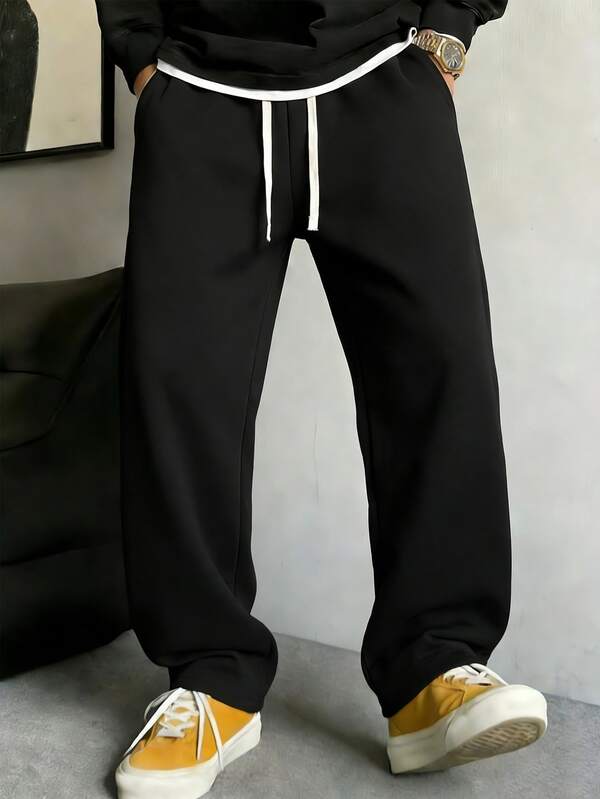 男士宽松休闲纯色阔腿裤，带抽绳腰带和大口袋，适合日常行走、工作、旅行和其他场合。