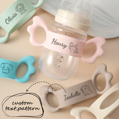 1pc Personalized Customization Debossed Name And Pattern Wings Silicone Baby Bottle Cover Lightweight Baby Bottle Handle Grip Sleeve With Partial Protection, Anti-Slip Design For Bottles And Water Cups Children Essentials Gifts ,Travel Organizer ,Baby Girl Newborn Essentials