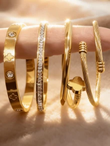 4件套女士金手镯套装，可叠戴的奢华手镯，饰有四叶草雕刻和立方氧化锆，扭曲心形搭扣设计，不锈钢防水材质，适合日常佩戴、派对佩戴以及作为礼物。 - 金色 - 查看 4