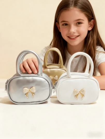 时尚新款儿童蝴蝶结手提包，适合女孩，节日礼物，公主风迷你包，零钱包，小圆包，简约包。有金色、银色、白色、黑色和粉色可选。非常适合购物和携带零钱。可爱的小女孩小包。