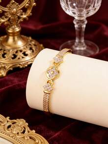 Camhanno 1 pièce - Bracelet en cuivre incrusté de fleurs en zircone. La texture complète en zircone est associée à un anneau circulaire dynamique, dégageant un sentiment de luxe et en faisant une touche de finition parfaite pour les tenues de tous les jours. - Doré - Voir 4