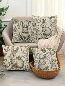Bộ 4 vỏ gối in hình, gối tựa in hình thỏ cho ghế sofa phòng khách, kết hợp với cây xanh xung quanh để tạo không gian ấm cúng và tự nhiên. Sản phẩm cũng có sẵn dạng gối cùng kiểu dáng đựng trong giỏ, thích hợp cho trang trí nhà cửa, kích thước 17.7x17.7 inch. - màu xanh lá - Xem 4