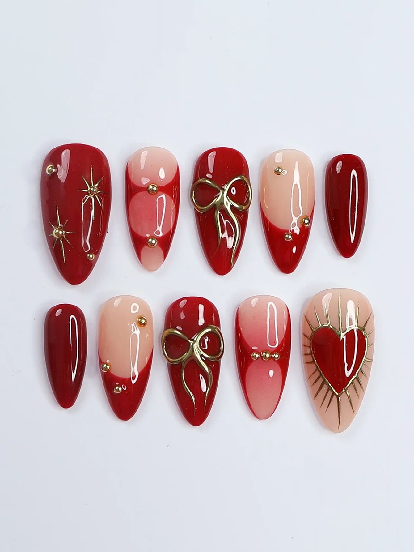 10片纯手工制作美甲贴片，长款杏仁甲，红色系美甲，甜美酷炫奢华风格，裸粉色搭配红色法式晕染，手绘蝴蝶结、爱心、星爆图案，金属钻石点缀，甜美精致，充满活力，适合女性和女孩，春夏秋冬节日情人节派对及日常佩戴。 - 紅色 - 查看 1