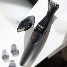PHILIPS 飞利浦 MG1100/16 多功能理容 1000 胡须修剪器，双重精准切割，21 毫米精细剃须刀头，3 个梳子，全身可水洗，AA 电池供电（不含电池），男士面部毛发造型器 - 黑色 - 查看 7
