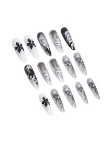 Sanrio 用这套30片装的假指甲来改变你的指甲吧！这款假指甲采用长杏仁形设计，融合了复古暗黑哥特风、前卫朋克风、Y2K甜美酷炫风以及现代休闲极简主义风格。 - 黑與白 - 查看 5