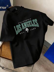 Simboliza la energía costera de California con palmera que evoca sol libertad y mar y el orgullo de Los Ángeles desde 1989 con carácter urbano y espíritu juvenil camiseta de hombre 100% algodón suave - Negro - Ver 1