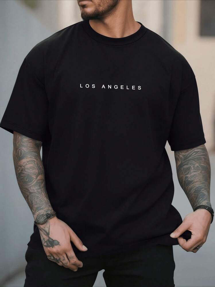 Tipografía LOS ANGELES evoca ritmo urbano de la  oeste libertad en movimiento y sue?os guiados por atardeceres del Pacífico y coraje diario camiseta de hombre 100% algodón manga corta cómoda - Negro - Añade 1