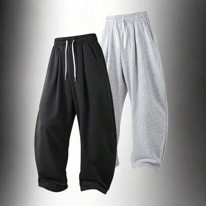 Quần ống rộng dáng suông nam, dây rút phối màu tương phản, chất vải mềm mại và rủ, tôn dáng, phù hợp mặc hàng ngày, đi làm, ở nhà và mặc thường ngày.