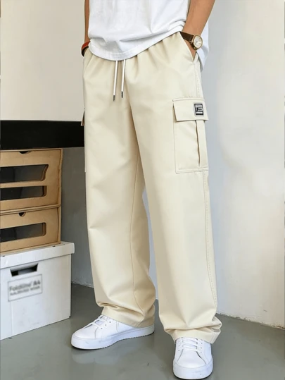 Pantalon cargo ample à jambes droites pour hommes avec poches latérales et taille à cordon, style cargo décontracté pour le printemps et l'automne