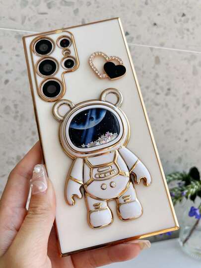 Astronaut Series Heart-Shaped Powder Coated Shockproof Phone Case With Electroplated Hidden Stand, Compatible With IPhone 11/12/13/14/15/16 Pro Max, S22/23/24+, A012345/654321, MOTO And Other Models