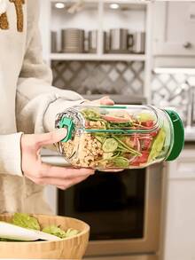 1个可放入洗碗机和冰箱的沙拉罐，侧开口设计，配有防漏盖。这款密封容器配有调味罐，采用可堆叠设计，非常适合备餐、午餐、晚餐和办公室使用（不含勺子）。 - 查看 4