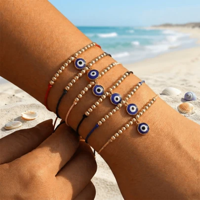 1件夏季时尚简约蓝色恶魔之眼吊坠手链，铜珠手链，幸运手链，彩色编织绳手链，红色编织可调节手链，祝福饰品，适合日常通勤佩戴，送给家人、朋友和爱人的礼物，生日礼物，家庭礼物