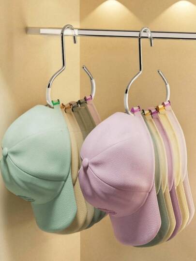 1个升级版挂钩帽架，黑/白通用辅助挂钩，适用于宿舍衣柜收纳、包包及配件收纳、悬挂式棒球帽展示，多功能帽架，节省空间设计，简约现代美学，耐用轻便的金属结构，易于安装，是小户型和时尚家居风格的理想之选，用途广泛，可用于宿舍和玄关收纳。