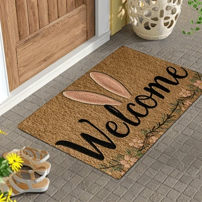 1 件粉色兔耳门垫，印有“欢迎”字样。可水洗，非常适合用于玄关、浴室、厨房和卧室。可用作浴室垫或家居装饰。室内外均可使用。