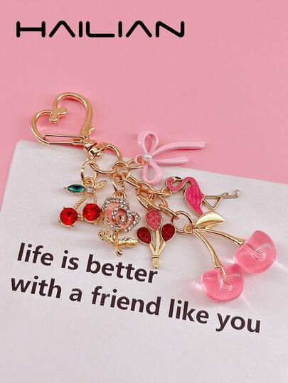 HAILIAN This Bag Accessory Is Made Of Alloy And Adorned With Rose And Flamingo Patterns, Accented With A Pearl Bow And A Deep Red Cherry Studded With Rhinestones. The Combination Of Pink, Red, And Gold Creates A Romantic Atmosphere. Whether Hung On A Bag Or A Keychain, It Exudes A Sweet And Sincere Charm. It Can Be Used As A Bag Accessory, A Car Keychain, Or A Lovely Little Gift For Birthdays Or Holidays.