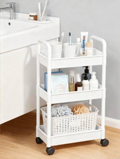 A Small Cart For Storage, A Movable Plastic Storage Rack With Grid Baskets, Featuring A Minimalist And Fresh Style With Swivel Wheels And Armrests, Capable Of Sorting And Storing Items, Suitable For Use In Bathrooms, Kitchens, Living Rooms, Bedrooms, And For Transporting Baby Snacks, Providing A Convenient Solution For Organizing Daily Bathroom Spaces.