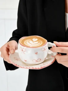 Bộ 1 tách và đĩa sứ nặn tay hình nơ và trái tim, kiểu Pháp dễ thương với họa tiết chấm bi nơ và trái tim, thích hợp dùng trong tiệc trà chiều và tráng miệng, quà tặng chất lượng cao, phù hợp cho nhà hàng, phòng khách, quán cà phê, làm quà tặng hoặc tiệc tùng. - Nhiều màu - Xem 6