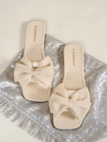 Sandalias planas para mujer, versátiles, con lazo negro casual y punta abierta, nuevas sandalias de plástico de ocio y playa para el verano 2025 - Beis - Ver 1