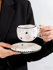 Bộ 1 tách và đĩa sứ nặn tay hình nơ và trái tim, kiểu Pháp dễ thương với họa tiết chấm bi nơ và trái tim, thích hợp dùng trong tiệc trà chiều và tráng miệng, quà tặng chất lượng cao, phù hợp cho nhà hàng, phòng khách, quán cà phê, làm quà tặng hoặc tiệc tùng. - Nhiều màu - Xem 10