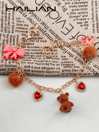 HAILIAN Esta adorable correa de bolso y cadena de extensión de oso de peluche está hecha de aleación y presenta un lazo Y2K, pompones esponjosos y un corazón brillante con diamantes. El oso Kawaii se puede usar como un encanto de bolso, correa para el hombro o cadena de extensión, y también hace un pequeño regalo encantador para familiares y amigos.